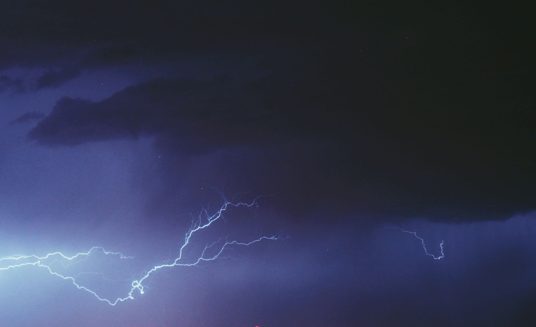 A striking image of lightning illuminating a dark and stormy sky, capturing the dramatic intensity of a thunderstorm.