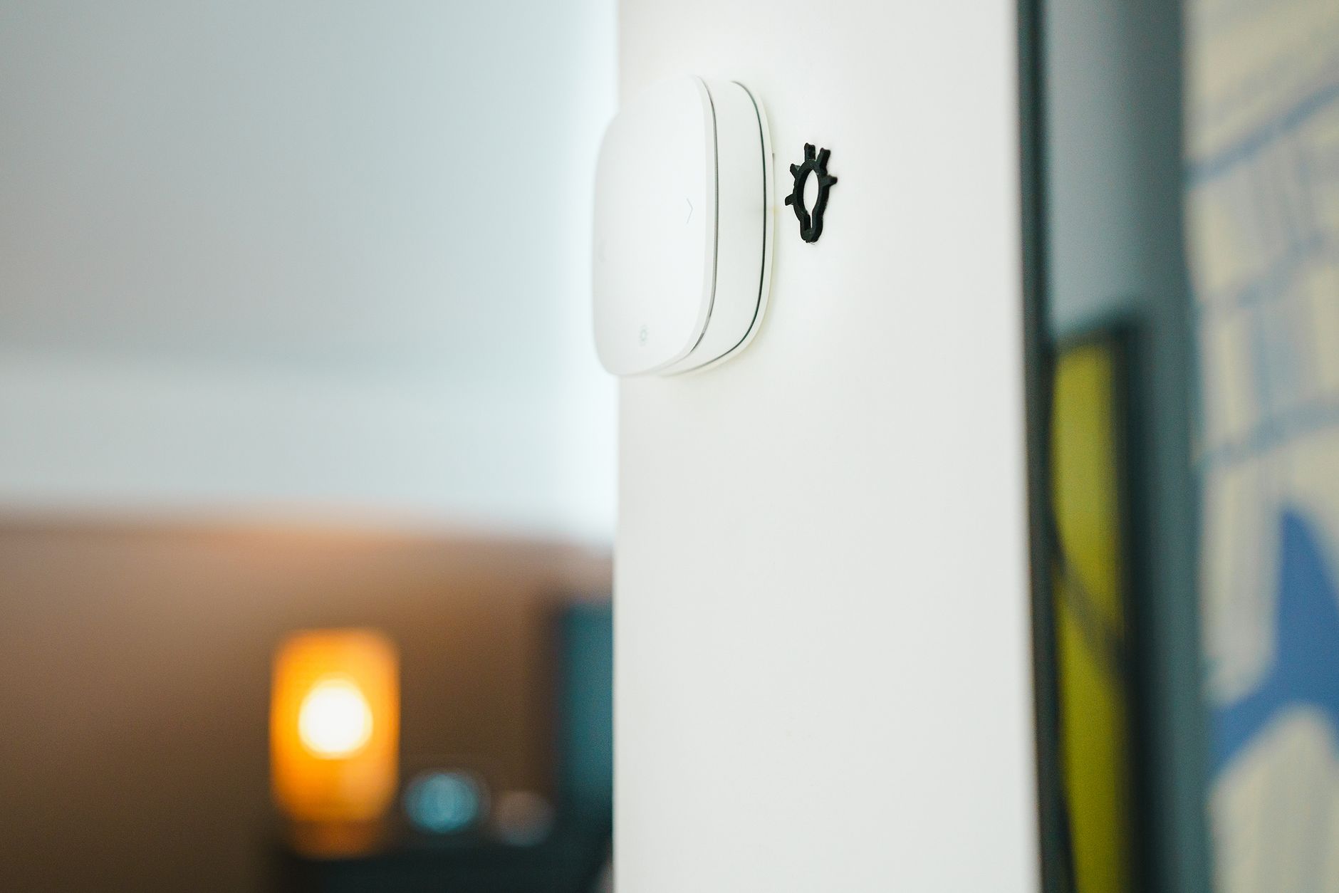 A sleek smart home light switch installed on a wall, showcasing modern technology in living spaces.