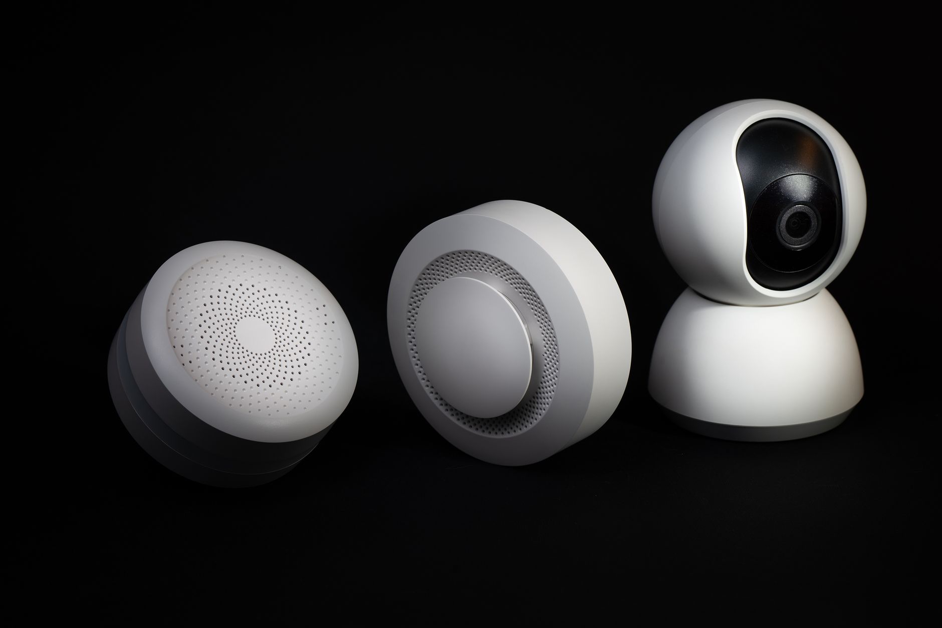 Elegant and innovative home automation devices on a sleek black background, showcasing modern technology.